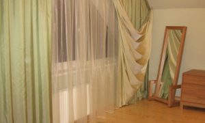 green non standard window curtains in bedroom