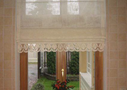 roman curtains with flower on the windowsill