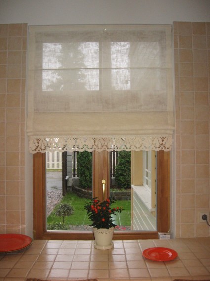 roman curtains with flower on the windowsill